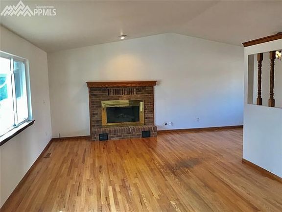 Oak floors in living room and dining room.  Gas fireplace