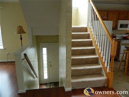 Stairs to front door and upstairs