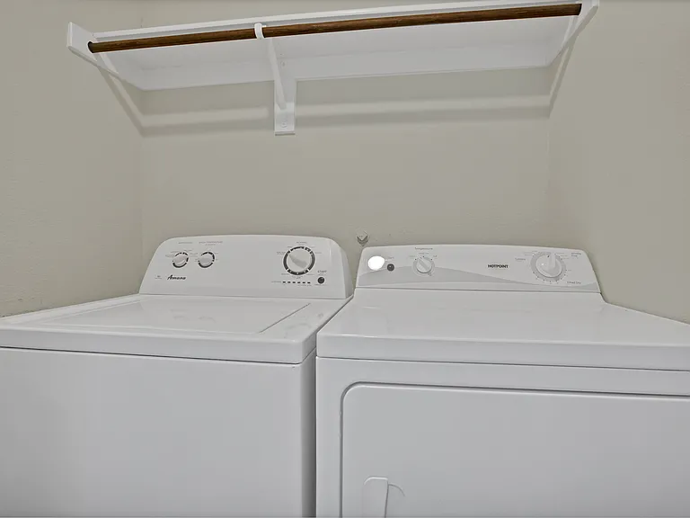 Full-size laundry area with washer and dryer