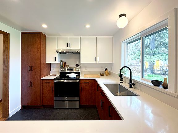 Newly renovated kitchen with efficient layout, lots of counter space and storage.