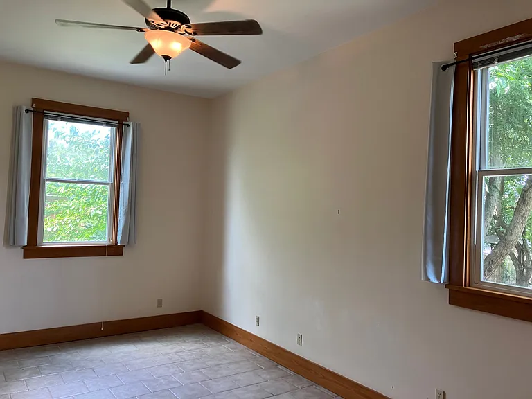 Two windows in right bedroom. All windows have miniblinds