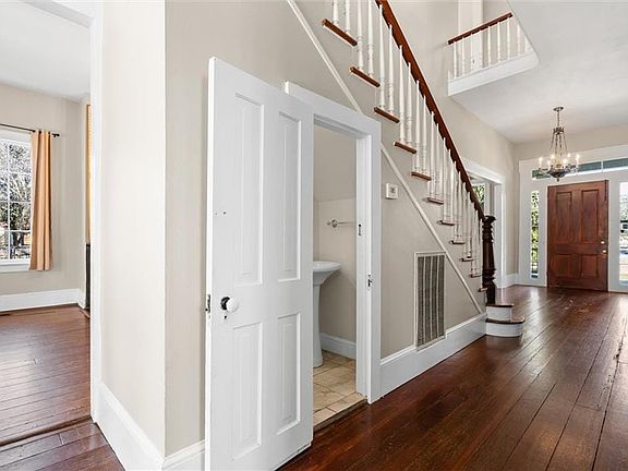 Foyer featuring a chandelier and dark hardwood / wood-style flooring