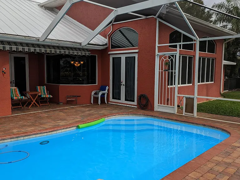 A retractable awning (electronically controlled) allows you to extend the shaded seating area from the home all the way to the edge of the pool!