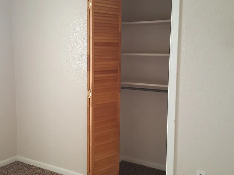 1st bedroom small closet.
Room is 10 x 11