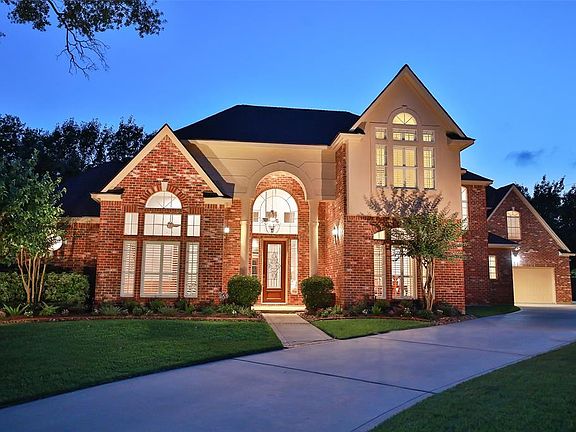 SLEEK SOPHISTICATION DESCRIBES THIS MODERN TRADITIONAL HOME - This Custom home has been meticulously cared for and recently updated. The curved driveway leads to a 3 car garage with side entrance. Roof was recently replaced, painted garage doors & re