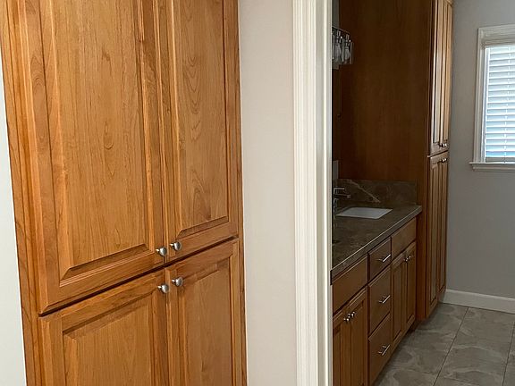 A lot of cabinet storage and hall closet across from cabinets