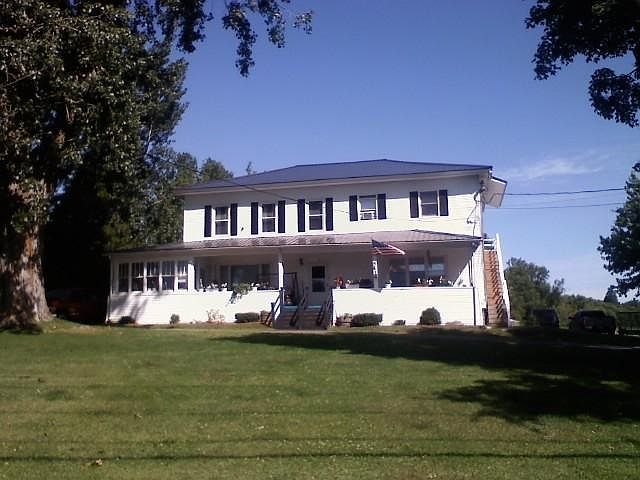 Photo is of the front of the whole house; Apartment for rent is located on the left of the photo, from the left of the front step including the enclosed porch.