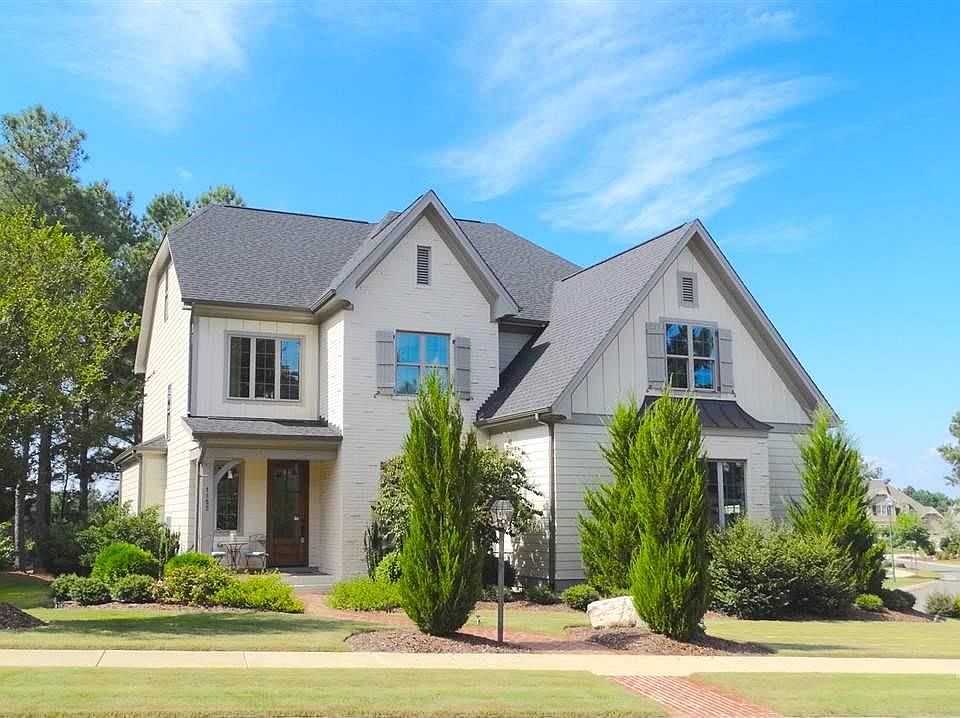 Gorgeous Brick and Hardiplank home on lovely street with side-load garage that backs to Golf Course.