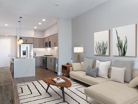 Signature Collection living and dining area with hard surface flooring