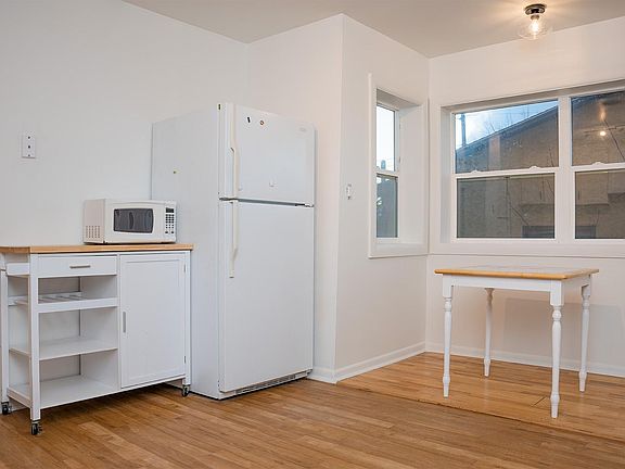 Kitchen and window-filled breakfast nook.