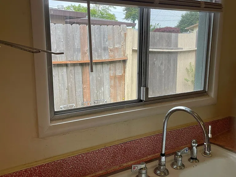 Bright Kitchen View Looking Out To Private Yard