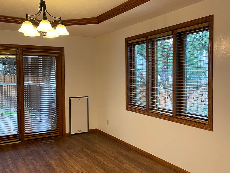 Dining room with patio door to back yard and dog door to dog run area.
