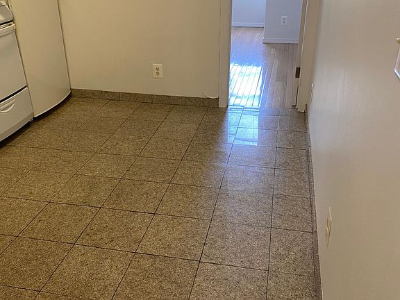 Eat in Kitchen leads to back bedroom.