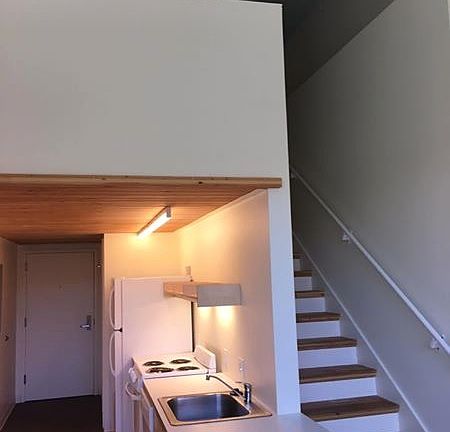 stairs up to bedroom and kitchen