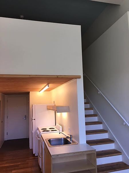 stairs up to bedroom and kitchen