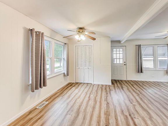 Living Room with side door access to patio