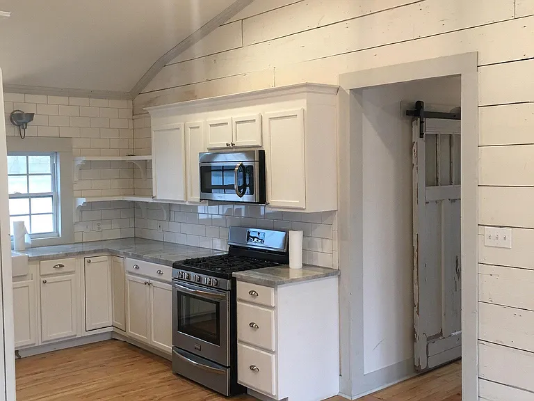 Kitchen and hallway to rear exit and bedrooms
