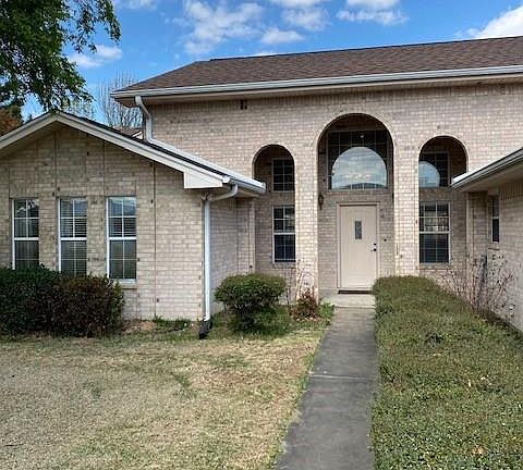 WALK UP YOUR SIDEWALK TO ENTER THIS HOME.