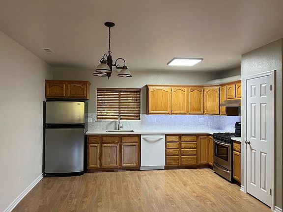 Kitchen and dining area open to living room. Newly remodeled.