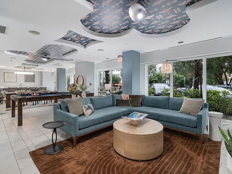 Unwind in style at your sophisticated community lounge that is a chic bayside retreat designed for connection and comfort