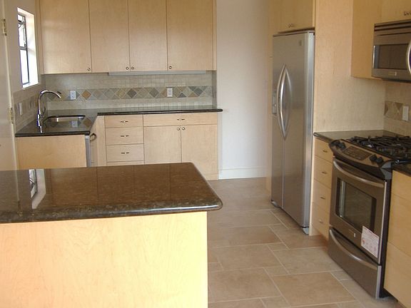 New kitchen- appliance stickers still attached.