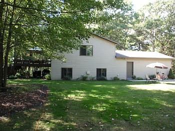 View of the Back of the home, a nice size yard for the kids to play...