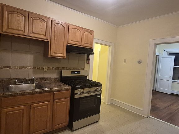 Kitchen with Brand New 2025 Stove. Refrigerator with ice maker and pantry