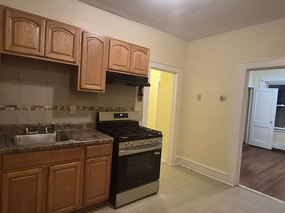 Kitchen with Brand New 2025 Stove. Refrigerator with ice maker and pantry