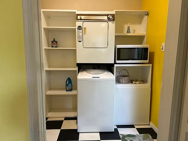 Just off the kitchen the private laundry room includes washer and dryer, huge wall of storage and separate hot water heater. Microwave included.