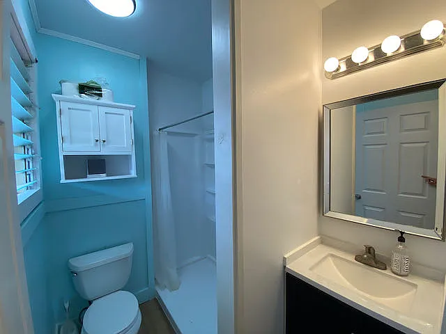 Primary suite's private bathroom with full shower