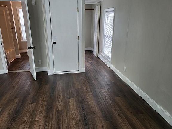 View into storage closet and bathroom