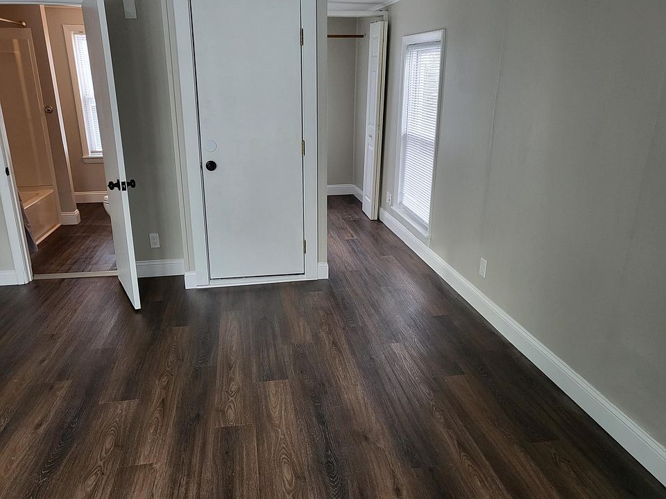 View into storage closet and bathroom