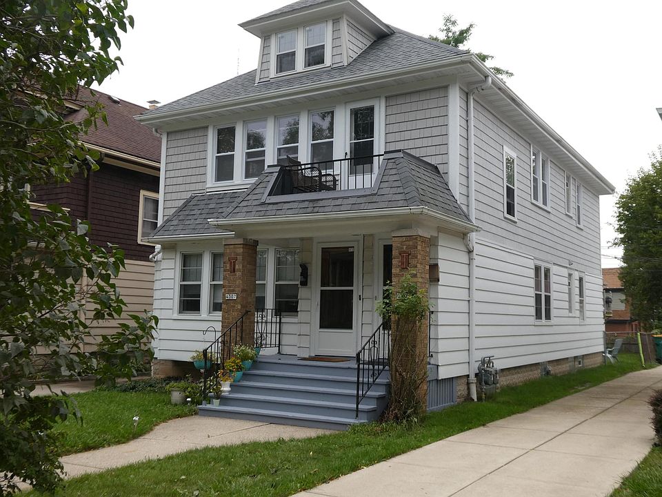 Front, new siding and windows.