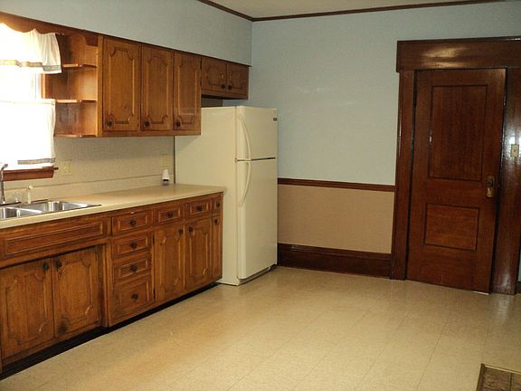 Kitchen facing door to storage and laundry area
