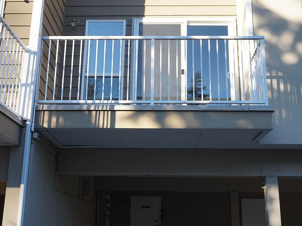 Back deck and covered parking space. Uncovered parking space also available