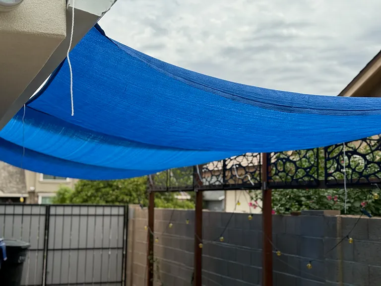 30' long shaded RV parking behind RV gate. West side of home which adds to cooling the west side where afternoon sun is the most intense. Big plus for the Big Toy owner