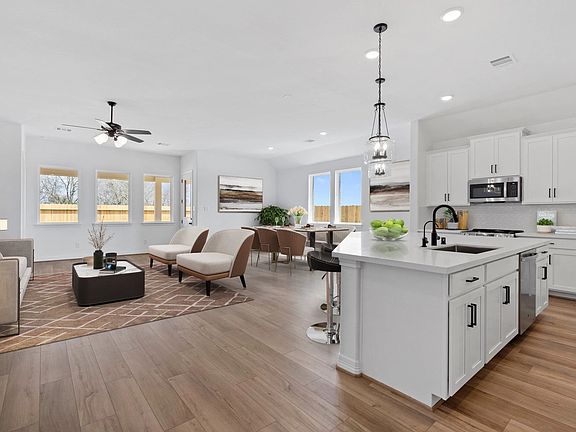 Kitchen and gathering room. Sample product photo. Actual exterior and interior selections may vary b