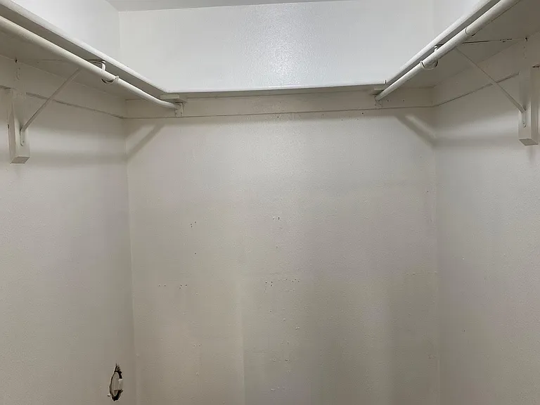 Walk in closet located in the master bedroom