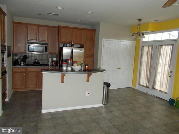 Kitchen and closet houses washer and dryer