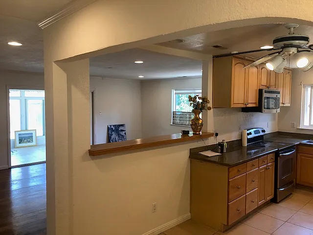 Front entry view: bar area, living room, and sun room