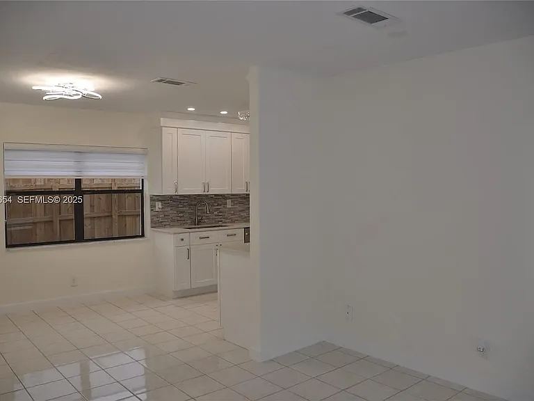 571 NE 61st St — Photo 36