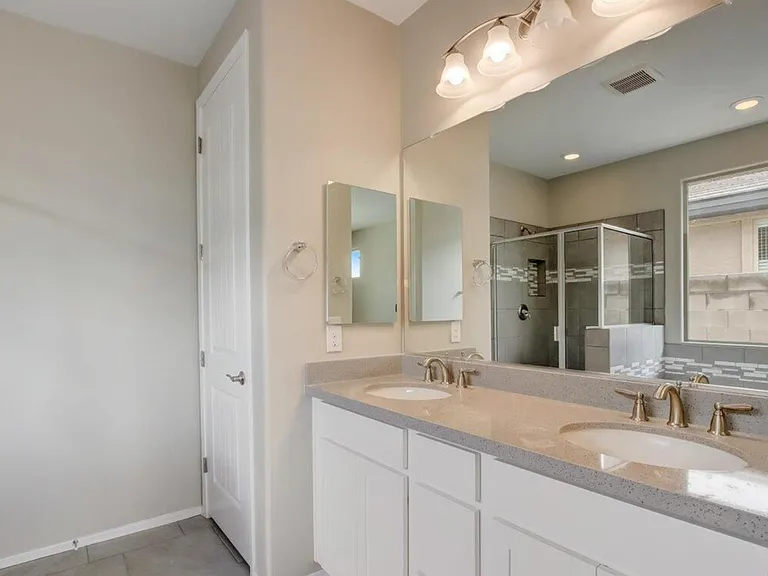 Primary bathroom dual sink and quartz countertops