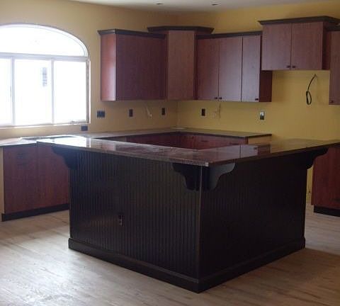 Open Kitchen with Granite Island & Cherry Cabinets