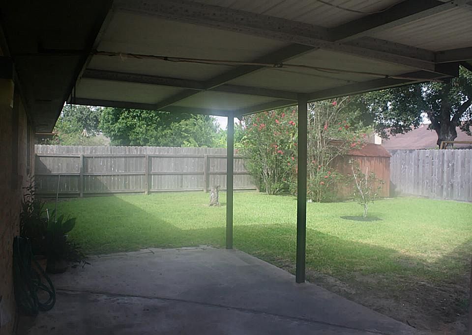 Covered Patio for hours of family BBQ's and kids playing.