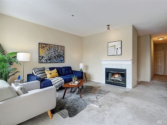 1223 sq ft, cozy wood burning fireplace, fresh paint and neutral carpet.