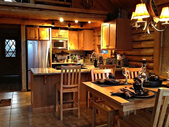 Kitchen area of cabin. Granite countertops and stainless ste