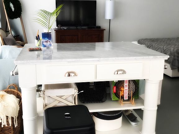 Beautiful marble kitchen island for desk, eating and food prep work.
