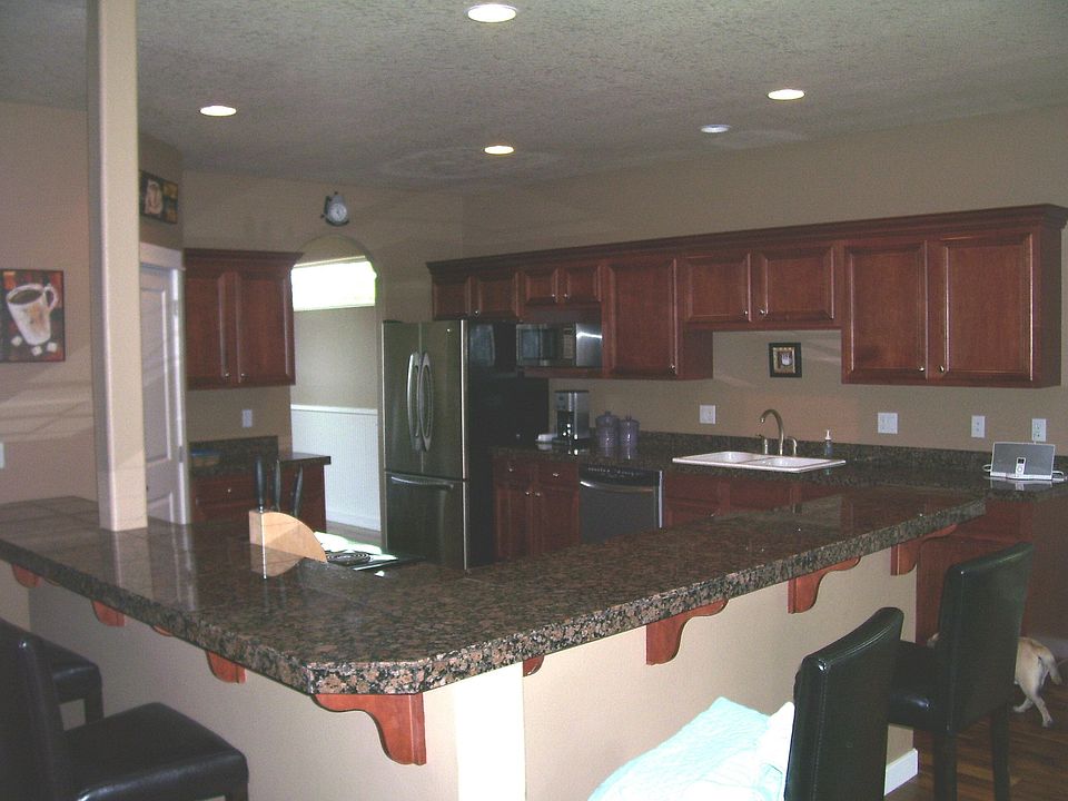 open kitchen with granite counters