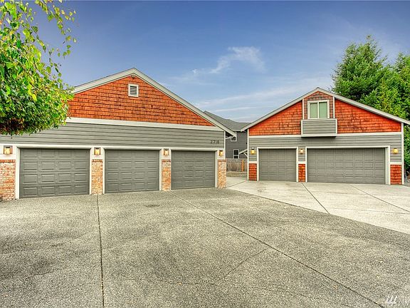 No shortage of room for all your vehicles, toys or hobbies with over 11 garage spaces! 3 car attached, detached 5 car shop, detached 3 car garage & a tractor shed.