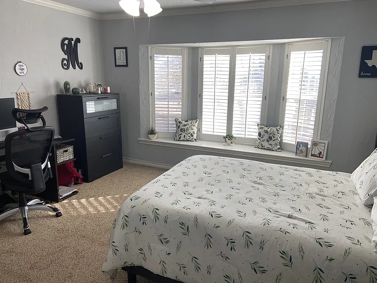 Primary Bedroom - furnished with full size bed, tall dresser, desk, chair, & nightstand. Decor items not included. Private space for occupant of primary bedroom.